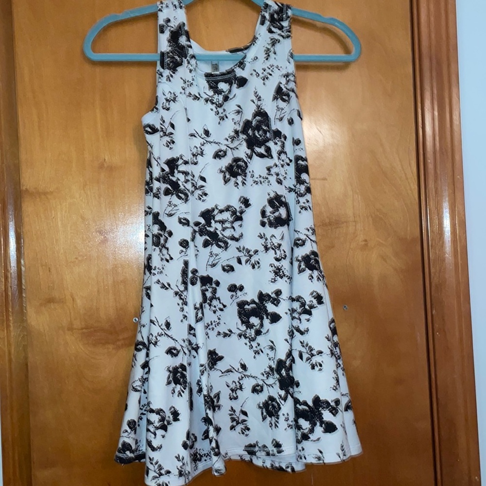 White sleeveless dress with black flowers